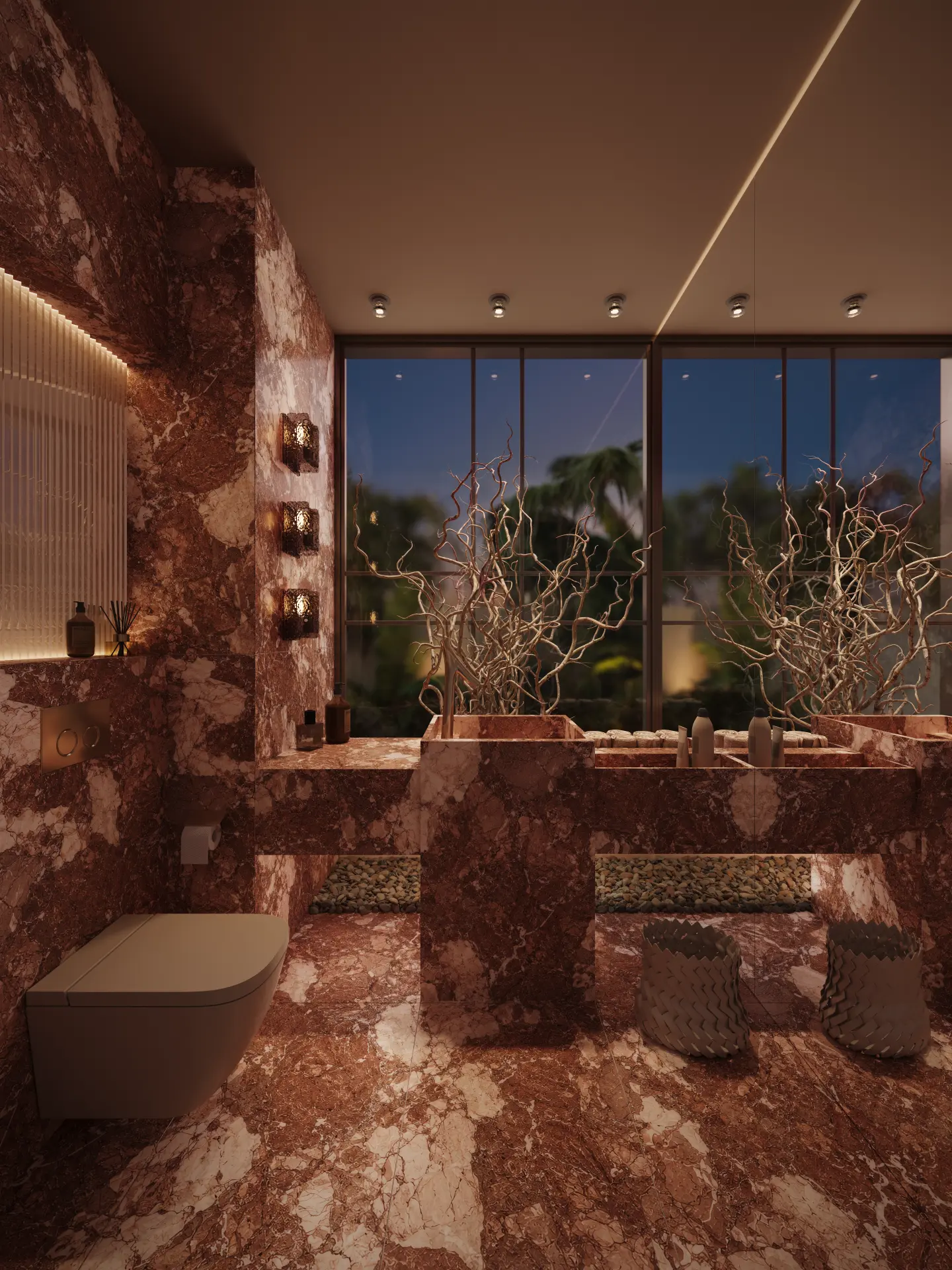 A powder room lined in deep red stone with a sculptural basin, warm lighting and polished metal fittings.