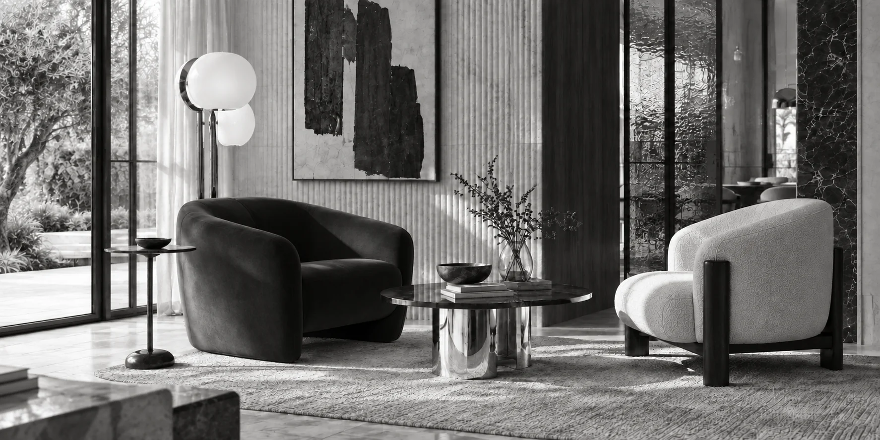 Black-and-white living room with two sculptural armchairs around a round marble table, a globe floor lamp and garden light.